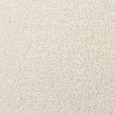 Zbliżenie na fakturę białej tkaniny boucle fotela Isshun, widoczna pętelkowa struktura materiału.